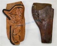 Two leather holsters one with floral carving both