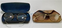 Pair of antique glasses and cases.