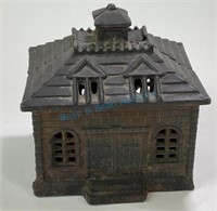 Large cast iron coin bank in the form of a