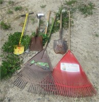 Group of hand tools including shovels, rakes,