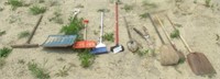 Group of yard tools including shovels, trimmers,