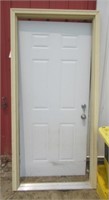 Exterior door with jamb and key. Door measures