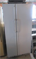 GE side by side refrigerator with toaster oven.