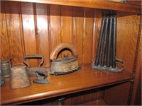 candle mold,sad irons,cow bell,weights & items