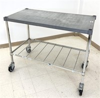 Amco 2 tier rolling cart, top shelf is polymer