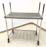 Amco two tier rolling cart. Top shelf is polymer