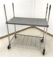 Amco two tier rolling cart. Top shelf is polymer