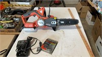 Black & Decker cordless chainsaw with charger and
