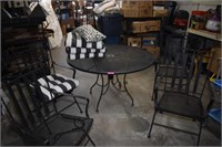 Wrought Iron Table & Four Spring Rocking Chairs