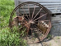 Two Spoked Iron Wheels approximately 48 Inches