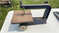 Antique iron band saw model 10 , measures 18x14