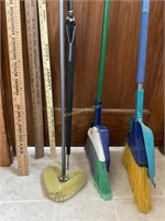 Brooms, yard sticks, umbrella, scrubber
