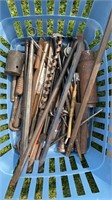 Blue basket of tools and iron rods , drill bits ,