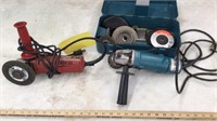 MAKITA GRINDER WITH CASE AND DISKS, AND A