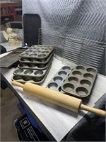 Quantity of muffin tins, cookie sheets, and large