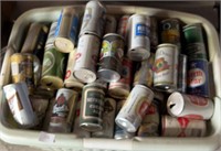 Laundry basket, full of vintage beer cans