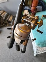Assorted fishing poles and reels
