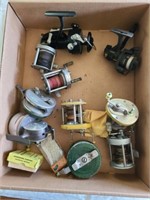 Box of assorted fishing reels