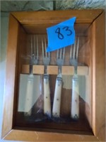 Fork collection in display case