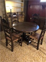 Pedestal Round Table with High Back Cane Chairs