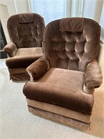 2 plush brown cloth swivel chairs