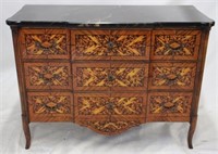 Intricately inlaid chest of drawers