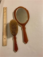 Vintage hand mirror and brush