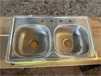 Stainless steel double sink/ needs cleaned