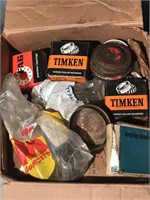 Box of assorted wheel bearings and more.