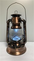 Copper finish lantern with LED light