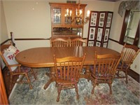 oak dining room table & china cabinet & rug