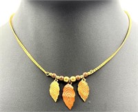 18k Gold Necklace With Metal Beads And Leaves