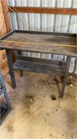Wooden table was used for potting plants back in