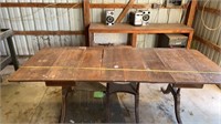 Side drop Table very old, has metal wheels and 4
