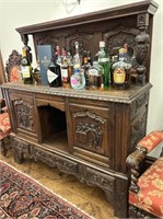 Antique Buffet featuring heavily carved figures