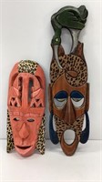 Carved African masks, largest is 24 in, leopard