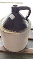 Ol’ brown antique jug, age crazing, chips along