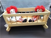 Toy wooden cradle with Raggedy Ann & Andy Dolls
