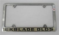 Vintage Olds license plate frame.