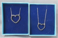 (2) Sterling Silver heart necklaces.