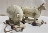 Two wooden animal pull along toys