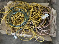 Many extension cords and hoses