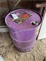 Approx. 15 gal diesel fuel in purple barrel