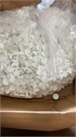 Open box of plastic lids