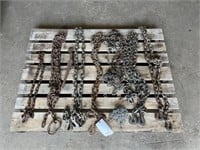 Various log chains many with hooks, chain binder