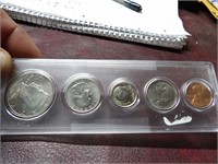 1993 COINS IN PLASTIC HOLDER IN NICE SHAPE