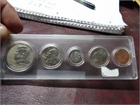 1997 COINS IN PLASTIC HOLDER IN NICE SHAPE