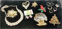 Small tray of costume jewelry includes rings,