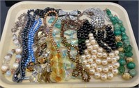 Tray lot of assorted costume jewelry includes