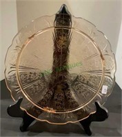 Beautiful pink depression glass cake plate with